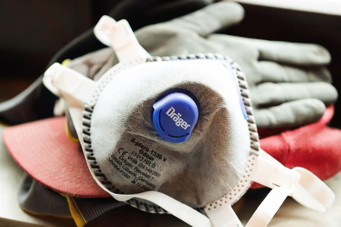 N95 respirator mask and work gloves used for small DIY mold cleanup in a Gettysburg PA home